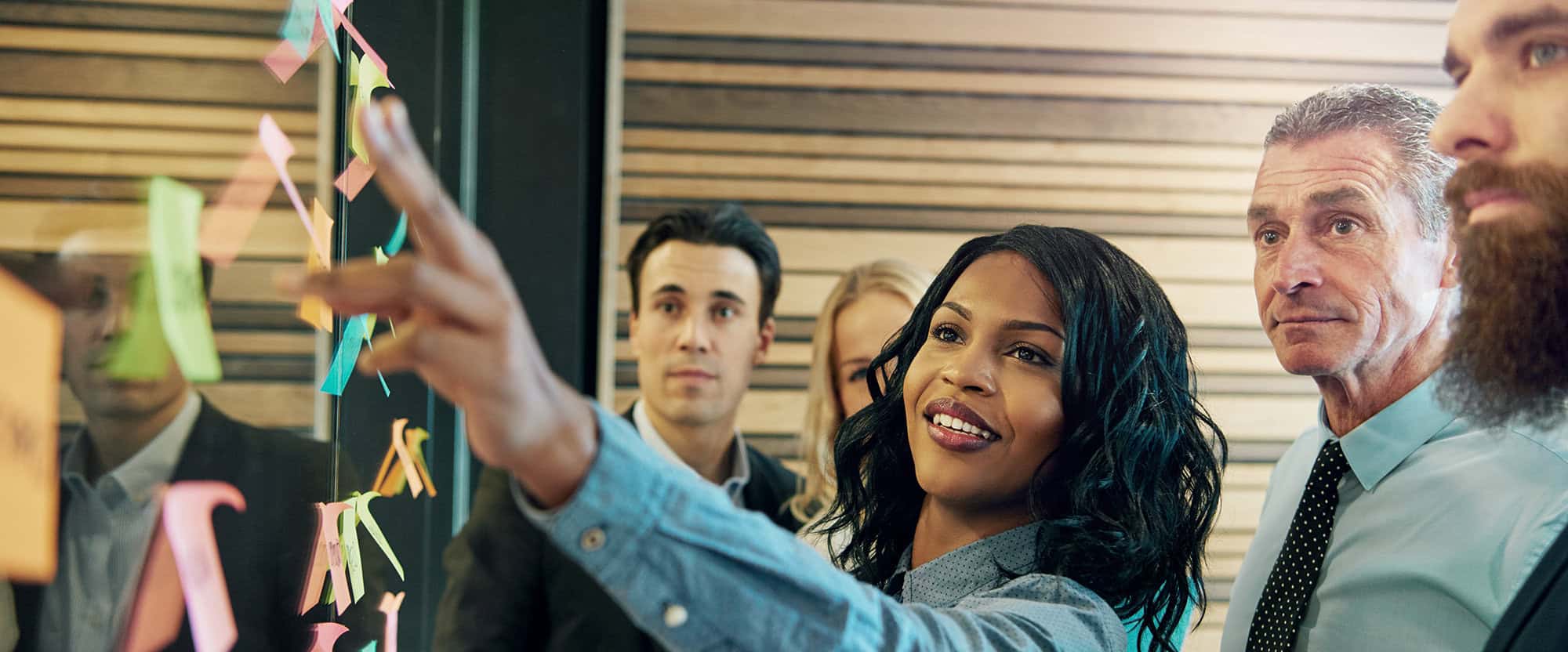 Woman explaining the plan to office team