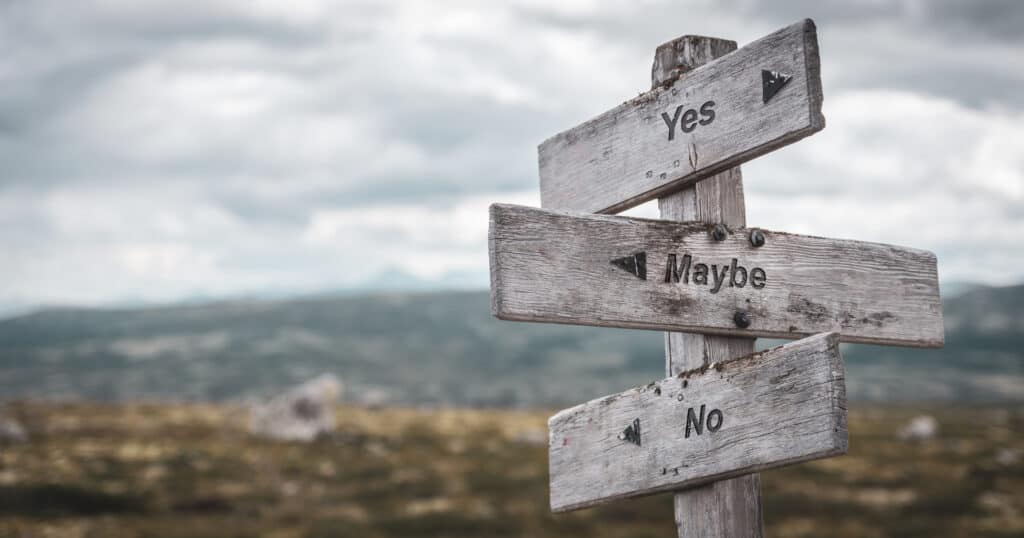 Image of a sign post with "yes, maybe, and no", pointing in different directions.